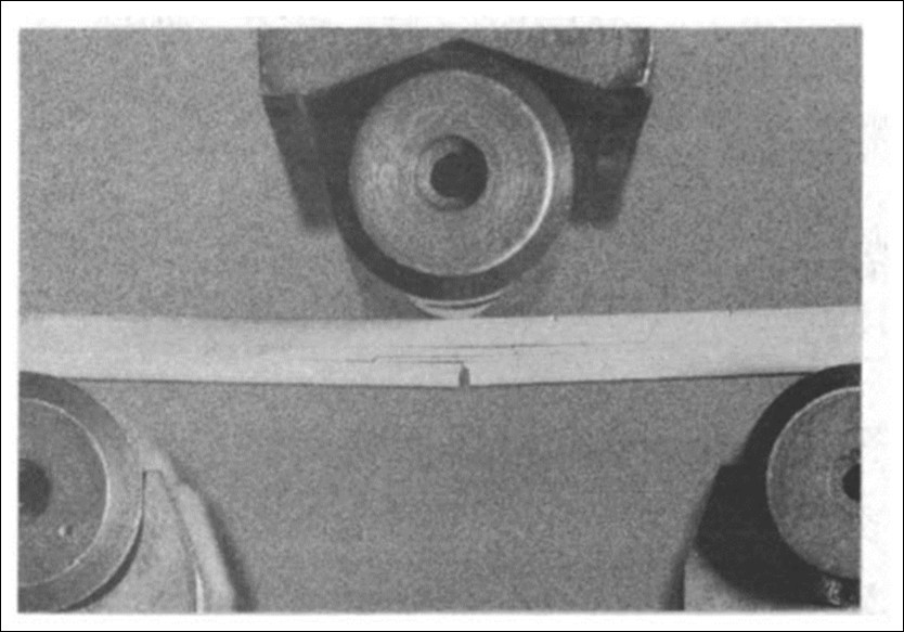 Bend testing a notched silicon carbide laminated composite, showing the crack deflexion